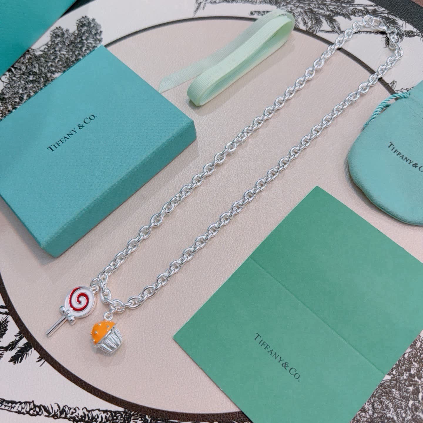 Tiffany & Co. Silver Charm Necklace with Lollipop and Cupcake Charms